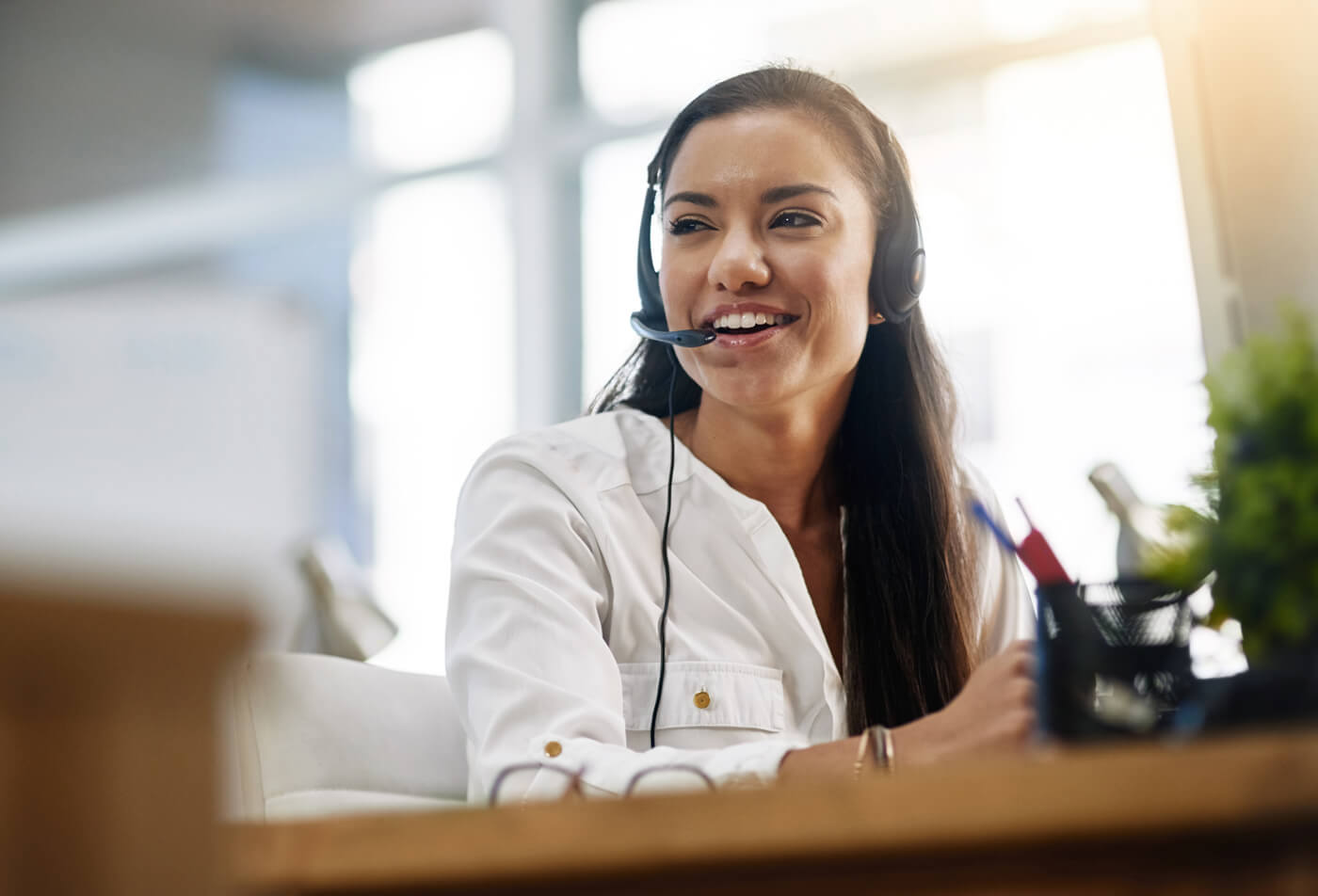 A support specialist speaking on a headset