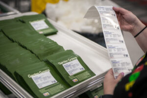 Person checking labels for product packages